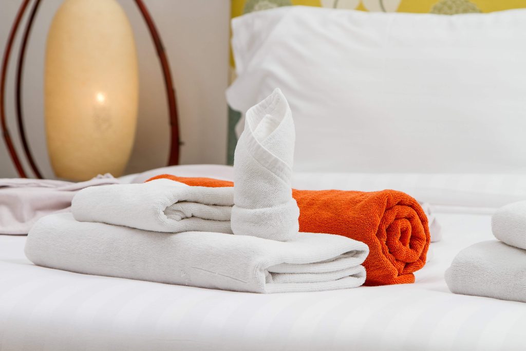 How Folding Towels into Fun Shapes Enhances the Guest Experience